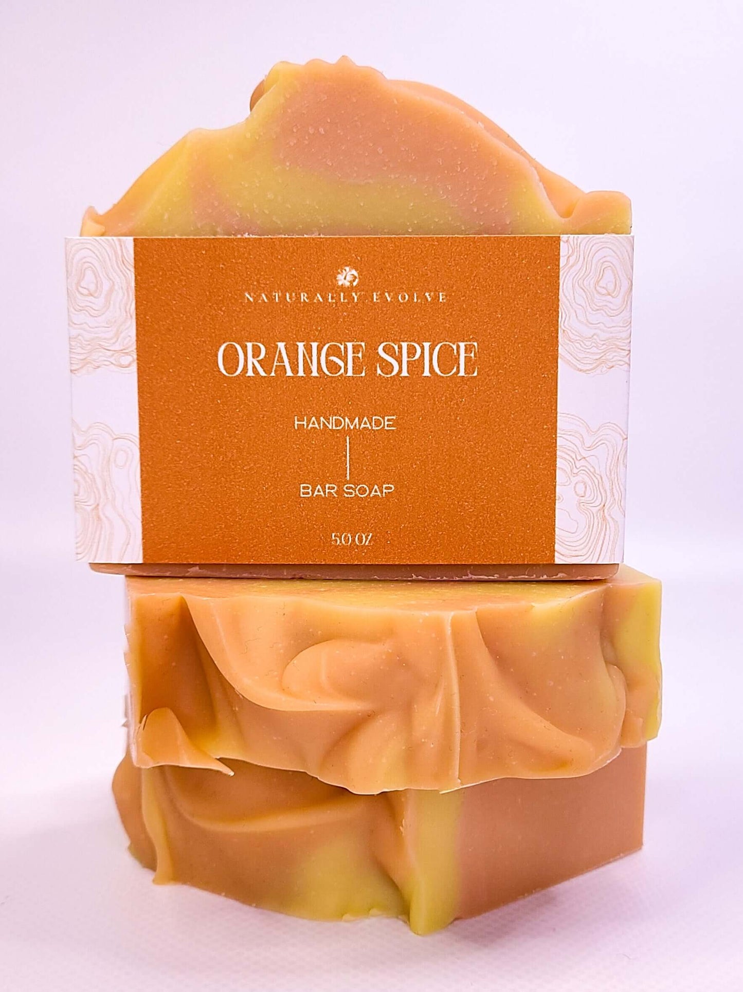Handmade Orange Spice bar soap with invigorating citrus and spice scent for energizing and refreshing skin care.