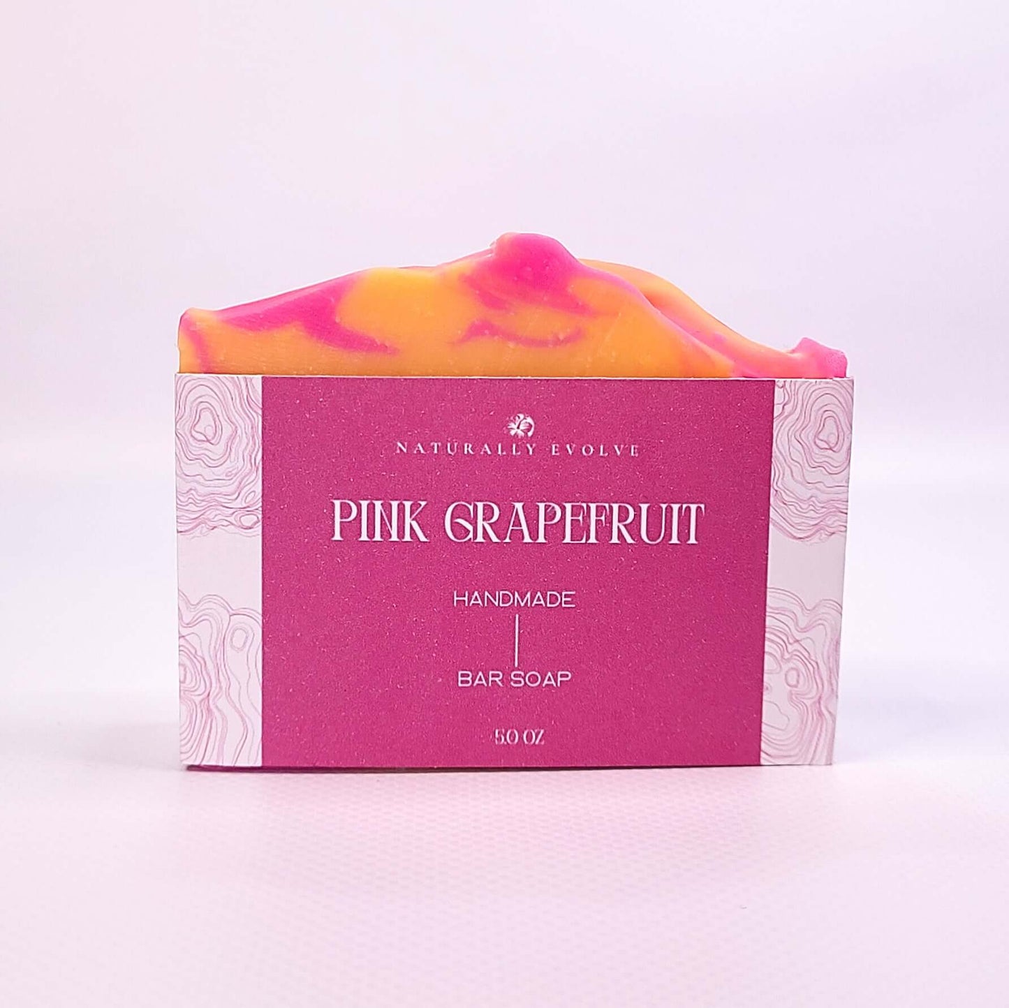 Pink Grapefruit soap bar with vibrant colors and refreshing scent, designed for an uplifting citrus cleanse and smooth, hydrated skin.
