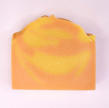 Orange Spice soap bar with citrus and spice swirls, invigorating scent, natural ingredients, energizing for fresh and soft skin.