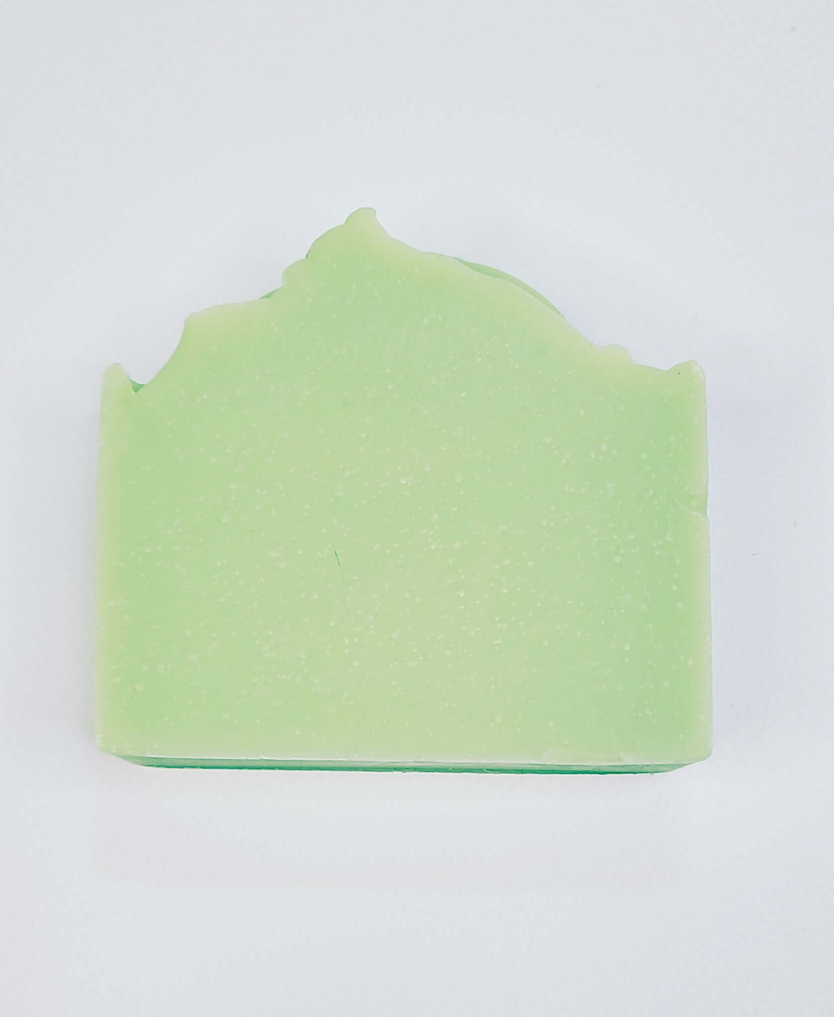 Light green Sour Apple soap bar with a playful, fruity scent for an invigorating and refreshing shower experience.